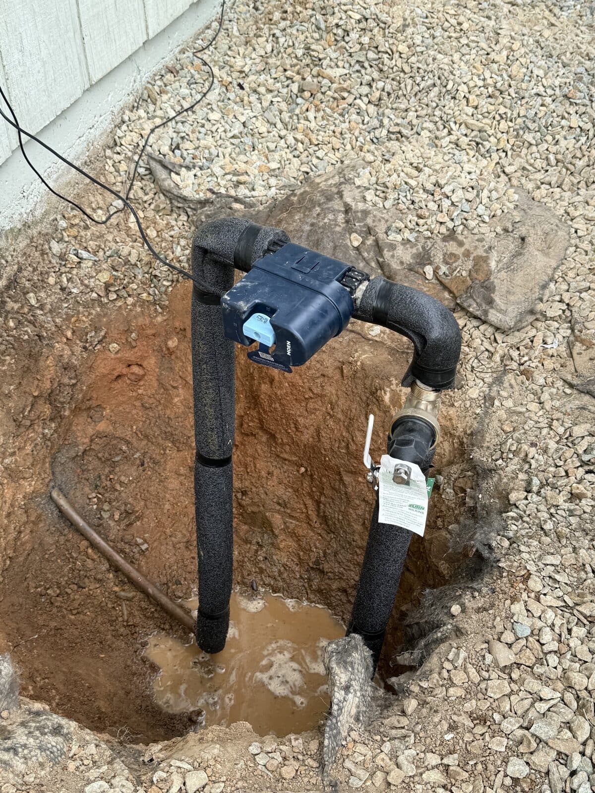 New underground line and shutoff valve set in an open trench